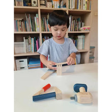 Load image into Gallery viewer, Child with Handy Carpenter Set by Plan Toys
