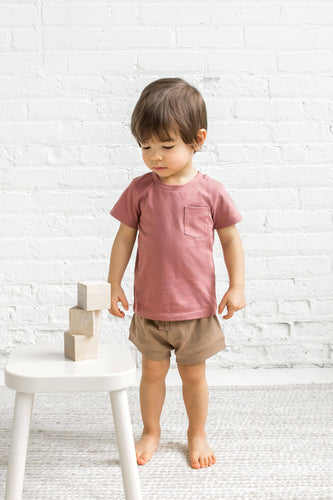 baby playing with blocks wearing truffle havana shorts