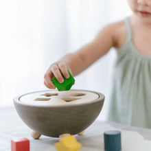Load image into Gallery viewer, Child playing with shape sorting bowl
