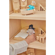 Load image into Gallery viewer, Child playing with PlanToys Victorian Furniture and Doll House
