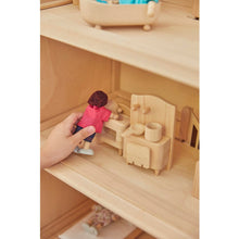 Load image into Gallery viewer, Child playing with PlanToys Victorian Furniture and Doll House
