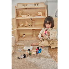 Load image into Gallery viewer, Child playing with PlanToys Victorian Furniture and Doll HouseSet 
