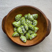 Load image into Gallery viewer, felt lime slices in a wooden bowl
