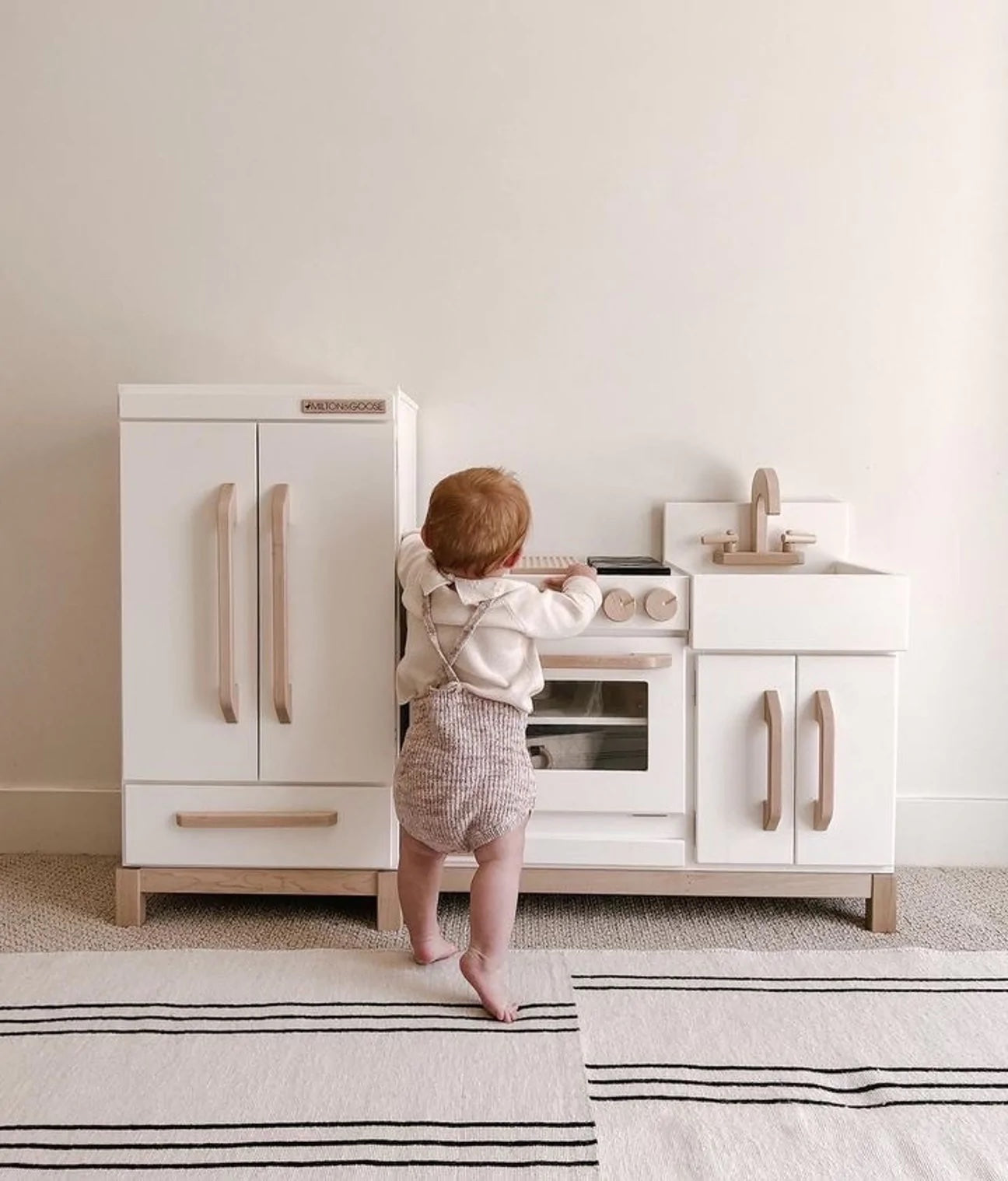 Play kitchen set by Milton and Goose in playroom