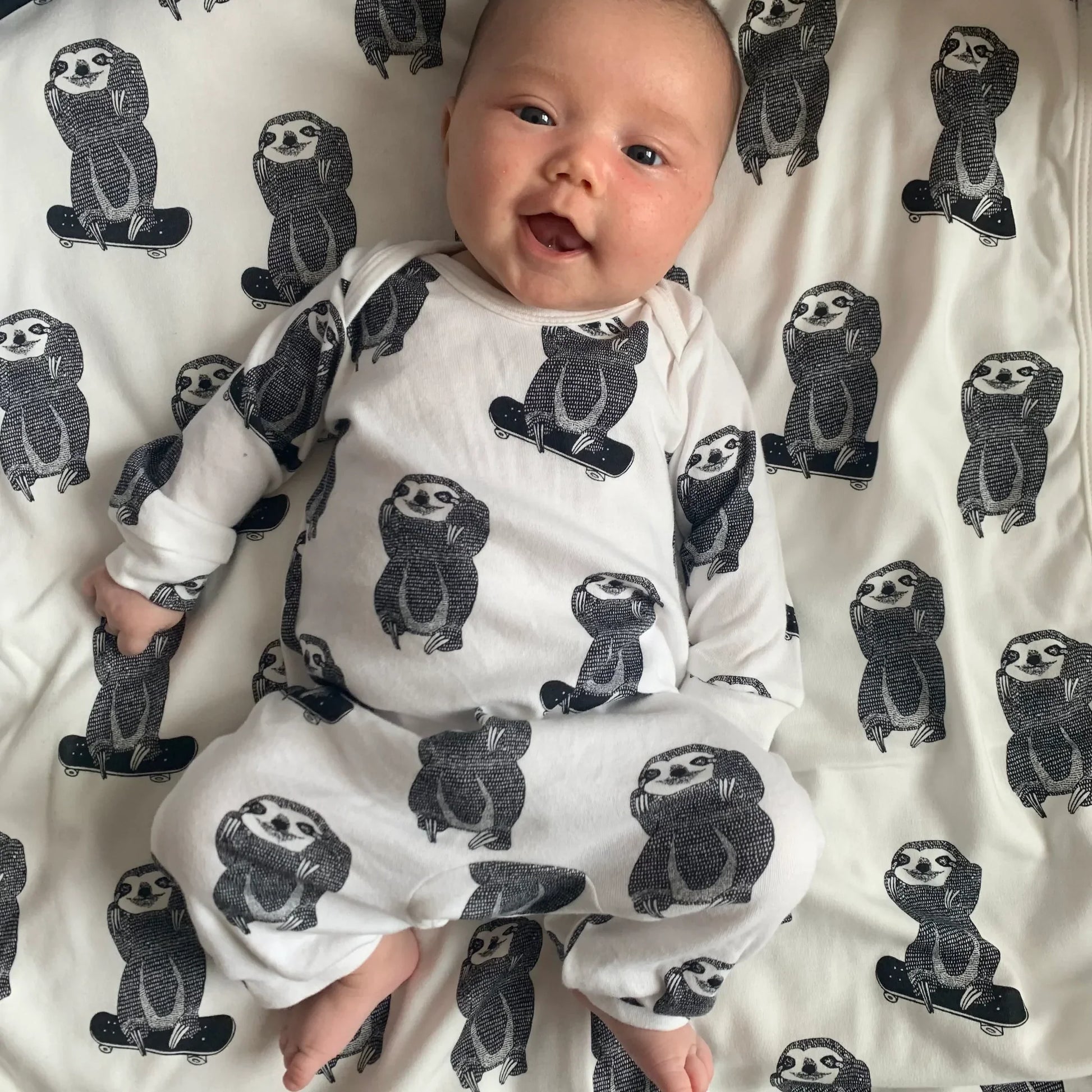 organic sloth romper on a cute baby