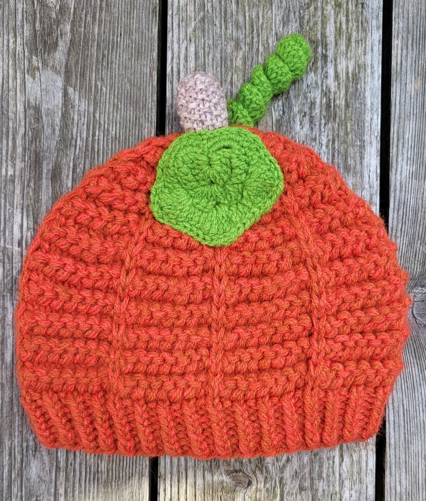 Pumpkin wool hat flat lay