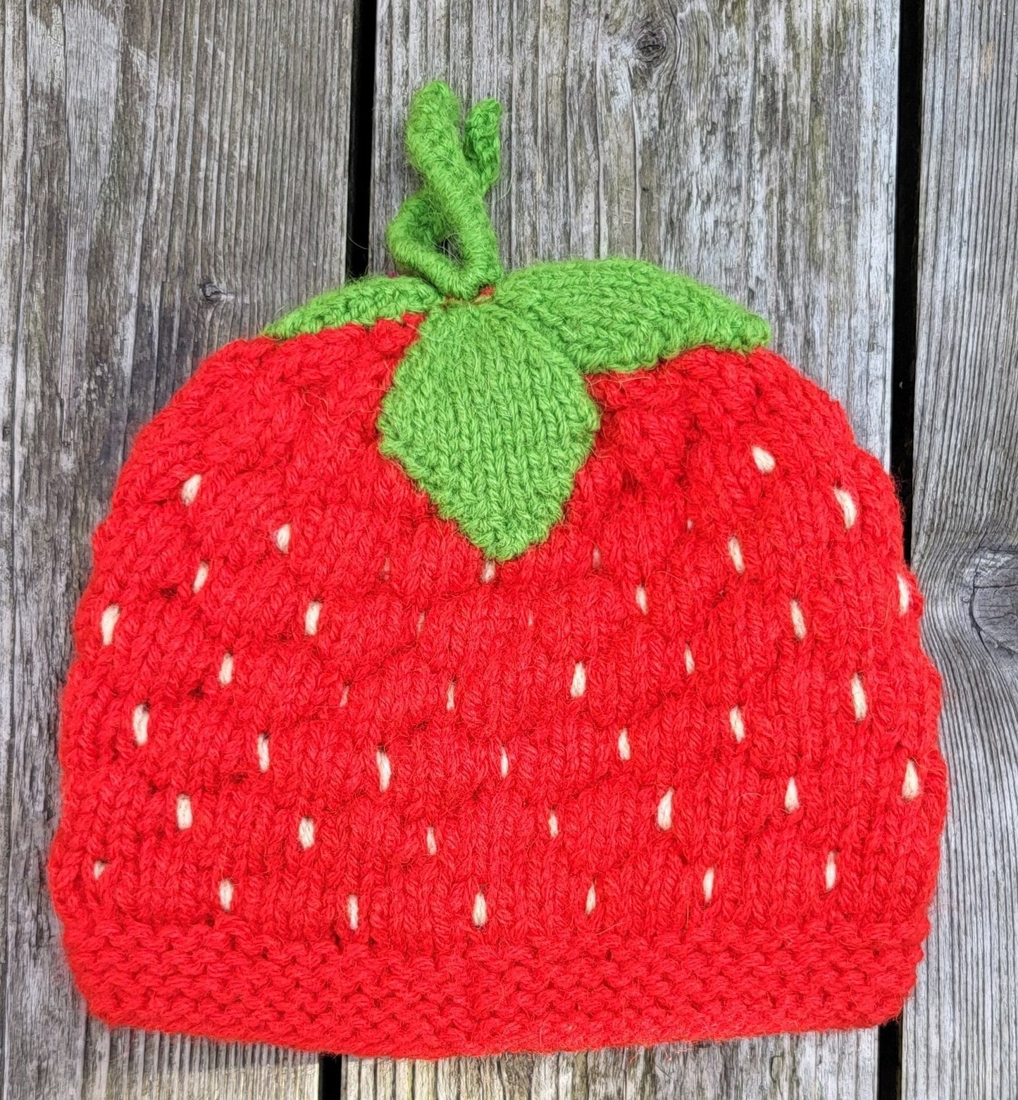 strawberry wool hat flat lay