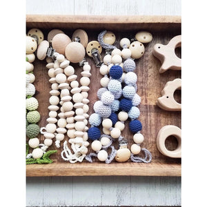 Whale Teether and crochet and wooden beads in a tray