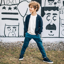 Load image into Gallery viewer, child standing outside wearing kay sweatpants by Jackalo

