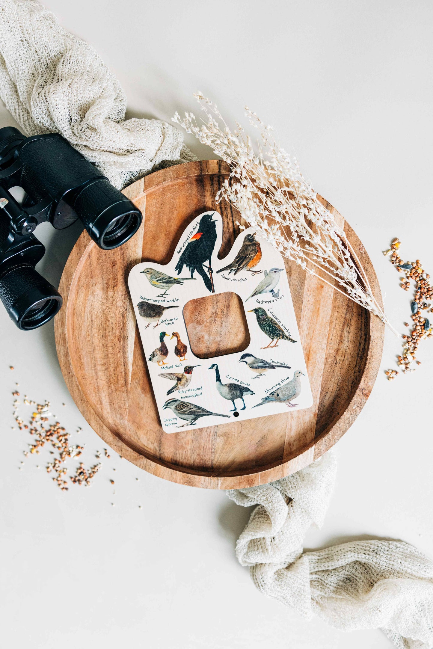 double sided bird finder laying on a tray