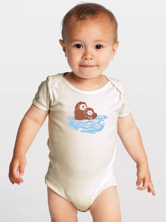 a baby wearing an organic cotton otters short sleeve onesie