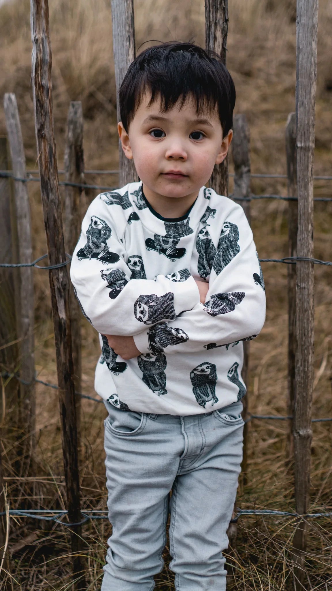 Kids wearing an organic skating sloth pullover