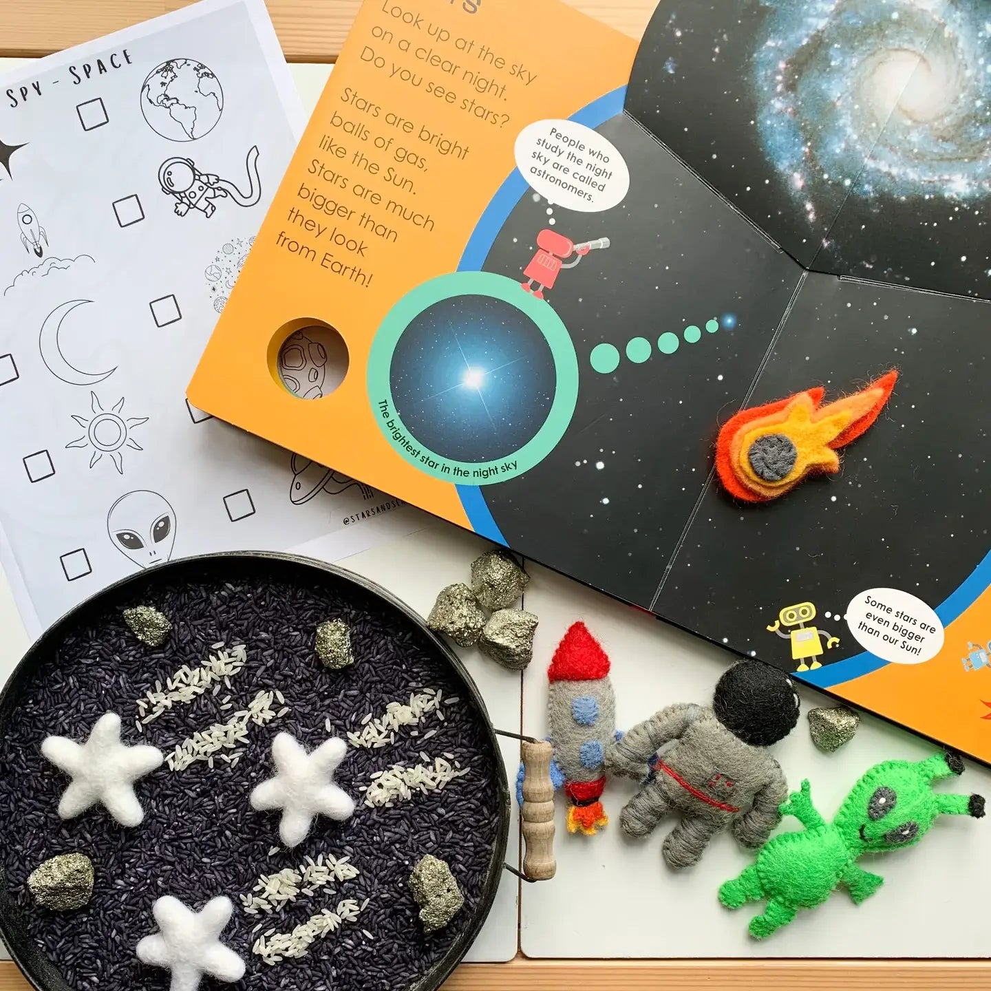 books, felt figures,  and rocks to learn about space