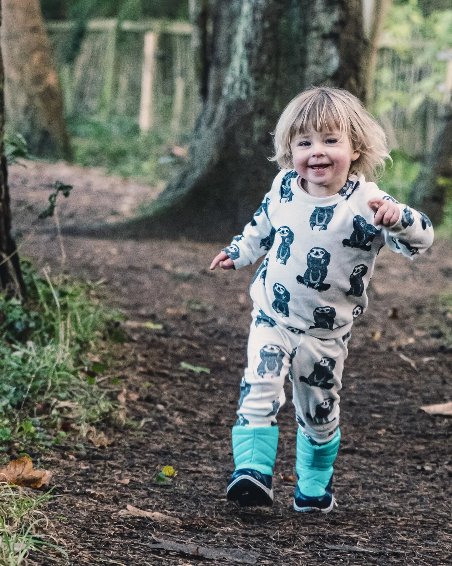 toddler running in a skating sloth pullover