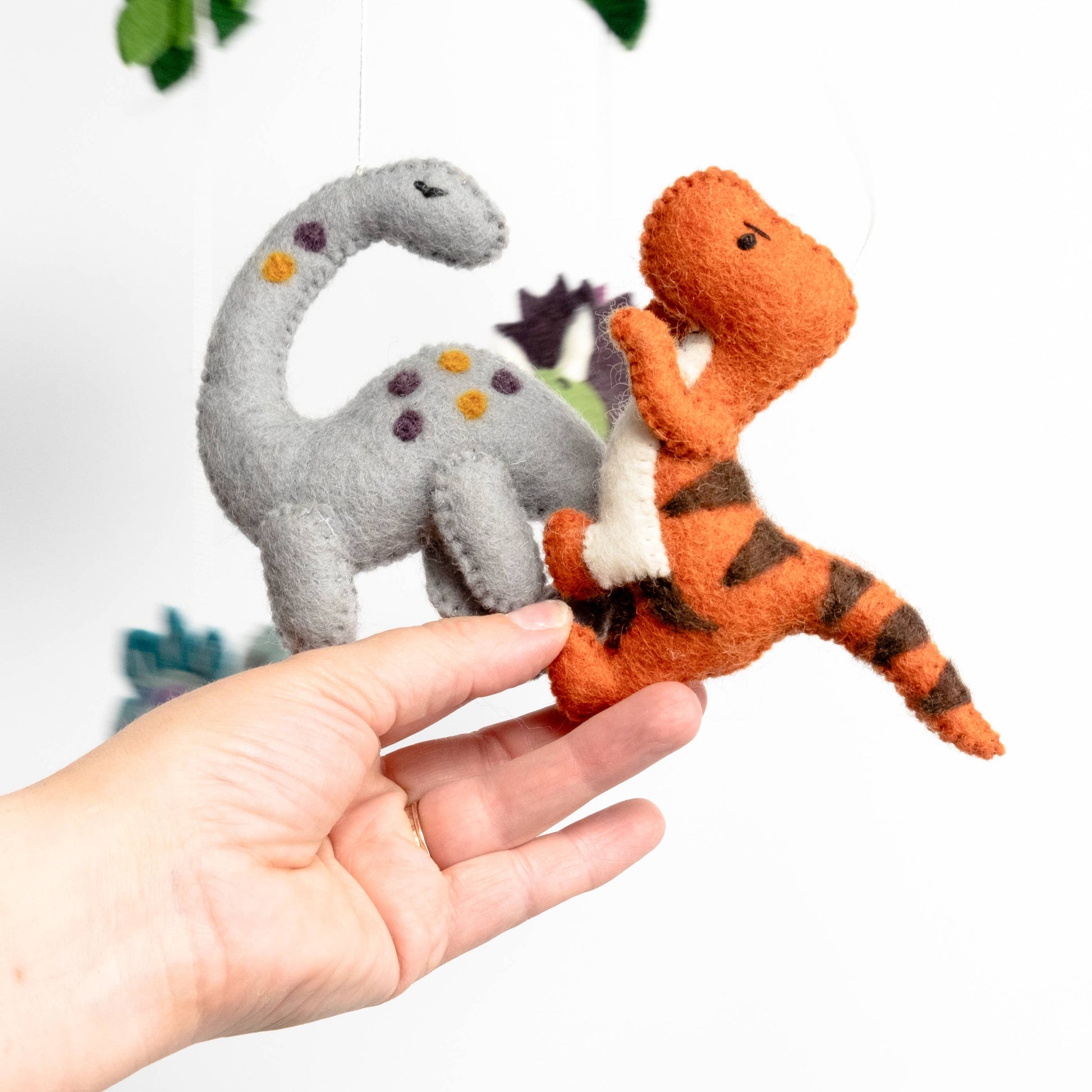 t-rex and diplodocus from baby dinosaurs mobile