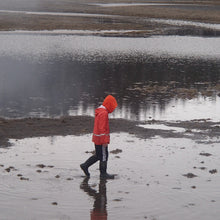 Load image into Gallery viewer, kid in a grundens rain jacket
